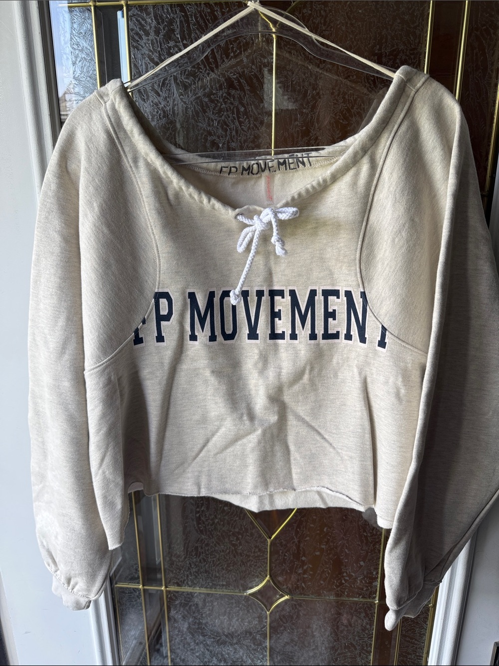FOR THE WIN OFF THE SHOULDER LOGOFree People Cream Cropped Hoodie with Navy Logo